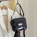Sac à bandoulière minimaliste en nylon noir avec boucles et sangle réglable pour le voyage - Noir