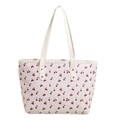White tote bag with red cherry prints and golden rivets on slim shoulder straps - White