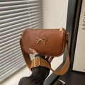 Chic tan faux leather underarm square bag with golden bow and wide woven strap - Brown