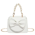 White faux leather mini bag with large bow and elegant pearl top handle strap - White