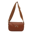 Brown vintage square crossbody bag with a gold bow buckle and adjustable wide strap - Brown