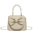 Schicke cremefarbene Mini-Handtasche mit Schleife und luxuriösem Kunstperlengriff - Khaki