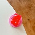 Detailed macro view of the 3D red gummy bear magnetic phone grip with translucent resin - Watermelon red