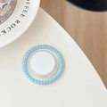 Detail of round phone grip featuring sky blue pearls and a minimalist white center disc - Lake Blue