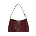 Chic vintage wine red oil wax leather underarm bag with gold ring accents on white background - Red