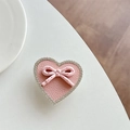 Detail of pink heart phone grip with polka dot bow and shimmering rhinestones - Transparent Stand - Pink