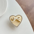 Detail of heart phone socket with rhinestone edge, yellow leather, and pink polka dot bow - Transparent Stand - Yellow
