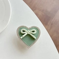 Detail of sage green leather heart phone socket with rhinestones and green polka dot bow - Transparent Stand - Green