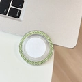 Detail of round phone socket with dual-row light green rhinestones on clear base - Green