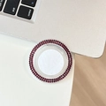 Macro shot of circular phone stand with sparkling deep red rhinestones and clear acrylic - Dark Purple