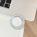 Macro detail of round phone socket with iridescent AB rhinestones on laptop surface - Iridescent