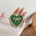 Detail of green heart phone grip with sparkling rhinestones and silver bow decoration - Transparent Stand - Rhinestone Heart Bow - Star Diamond - Green