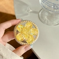 Detailed macro of yellow flower phone grip with gold pearls and heart sequins decoration - Pearl Magnetic Sugar Sequin Cherry Blossom / Yellow