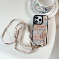 Detail of tweed iPhone case featuring integrated card wallet and detachable crossbody strap - Woven Pattern Triangle Wristband Wallet Crossbody Strap Multi-Brown / iPhone 17 Pro Max