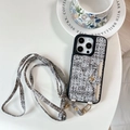 Detail of tweed iPhone case featuring card holder bow and adjustable crossbody strap - Woven Pattern Triangle Wristband Wallet Crossbody Strap Black / iPhone 17 Pro Max
