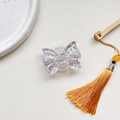 Macro view of transparent resin butterfly phone grip with purple glitter flakes inside - Expanding Stand / Purple