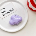 Detail shot of a glossy light purple cloud shaped retractable phone socket on a white tray - Magnetic-Purple
