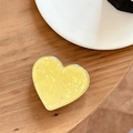 Close-up of heart-shaped phone grip with yellow star sequins and epoxy finish on wood - Electroplated Heart Stand - Starry Shell - Yellow