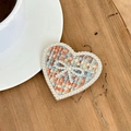 Detail of heart-shaped phone grip featuring tweed fabric and sparkling rhinestones - Transparent Stand-Rhinestone Heart Bow-Woven Texture-Colorful Brown