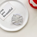 Macro detail of butterfly phone grip with silver glitter inside clear acrylic material - Magnetic Airbag Stand / Silver