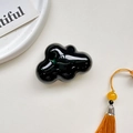 Macro detail of glossy black cloud phone socket on textured background with prop card - Airbag Holder - Black