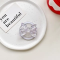 Detail of purple glitter butterfly magnetic phone grip with acrylic finish on white tray - Magnetic Airbag Stand / Purple
