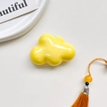Detail of a glossy bright yellow cloud phone grip with smooth polished finish and reflections - Airbag Holder - Yellow