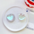 Close-up of heart-shaped iridescent phone sockets with pearlescent resin finish - Transparent Stand / Matte Heart-Iridescent White