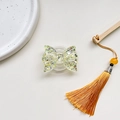 Macro detail of butterfly phone grip with sparkling gold and green glitter inside - Expanding Stand / Yellow
