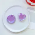 Detailed view of iridescent purple heart phone grip with pearlescent finish on a tray - Matte Heart-Iridescent Purple