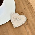 Macro shot of heart-shaped beige leather phone grip with rhinestones on a wooden table - Transparent Stand-Rhinestone Heart Bow-Leather Texture-Apricot