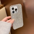 Close-up of sparkling full rhinestone iPhone case with silver metallic edges and hand strap - Rhinestone-Studded Single Case / Iridescent / iPhone 17 Pro Max