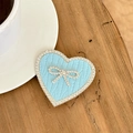 Close-up of light blue heart phone grip with bowknot rhinestone and knit texture - Transparent Stand-Rhinestone Heart Bow-Leaf Texture-Blue