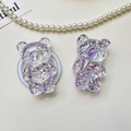 Macro detail of 3D bear phone socket with glitter sequins and purple resin filling - Bear - High-Shine Sequins - Purple