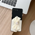 Detailed shot of silk bow with camellia flower and pearl charm for flip phone case - Samsung ZFlip3 / Cross Grain Camellia Bow Wristband-White