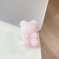 Dettaglio macro del supporto per telefono a forma di orsetto rosa su un laptop - Gelatina Chiara Rosa