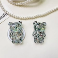 Detailed macro view of 3D bear phone grip with glitter sequins and metal ring stand - Bear - High-Shine Sequins - Black