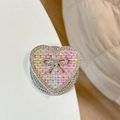 Dettaglio del supporto per telefono in tweed a cuore con strass e fiocco - Fiocco Cuore Strass Magnetico-Trama Intrecciata / Rosa Colorato