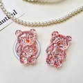 Close-up of cute pink glitter bear phone socket stands on a textured surface - Bear - High-Shine Sequins - Red