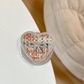 Dettaglio del supporto per telefono a cuore con strass e inserto in tessuto tweed - Fiocco Cuore Strass Magnetico-Trama Intrecciata / Marrone Colorato