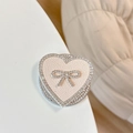 Detail of heart-shaped phone grip with leather texture and rhinestone bow decoration - Magnetic Rhinestone Heart Bow-Leather Texture / Apricot