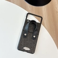 Detail of black textured leather phone case with convenient hand strap and silver rivet - For Samsung Z Flip 3 / Black