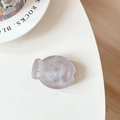 Macro detail of matte lavender fish-shaped phone stand showing textured 3D relief details - Brown (Brown Glitter)