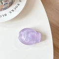 Macro view of a matte purple fish-shaped phone grip with a 3D textured frosted finish - Purple (Purple Glitter)