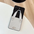 Detail of silver wrinkled leather phone case with metallic handle for Samsung Z Flip - Silver