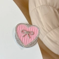 Detail view of pink leather heart phone stand with rhinestone bow and sparkling border - Magnetic Rhinestone Heart Bow-Leaf Texture / Pink