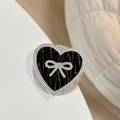 Close-up of black leather heart phone grip with rhinestone bow and sparkling border - Magnetic Rhinestone Heart Bow-Leaf Texture / Black