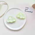 Detail of glitter cloud phone grip and matching accessory on white ceramic tray - Pearlescent Cloud-Light Green