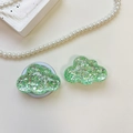Detail view of cloud-shaped phone grip with sparkling green sequins and resin finish - Cloud - High-Glow Sequins - Green