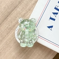 Detail of glitter bear phone grip with star sequins on a wooden background - Magnetic Glitter Bear / Green